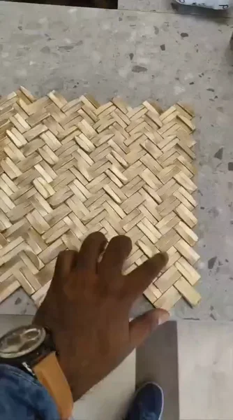 A raised, interlocking surface viewed from several angles to reveal its texture and depth.