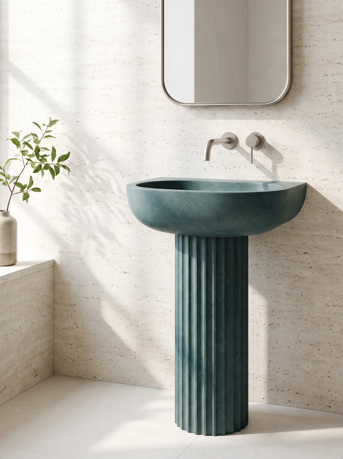Sculptural aquamarine basin and refined wall-mounted fitting